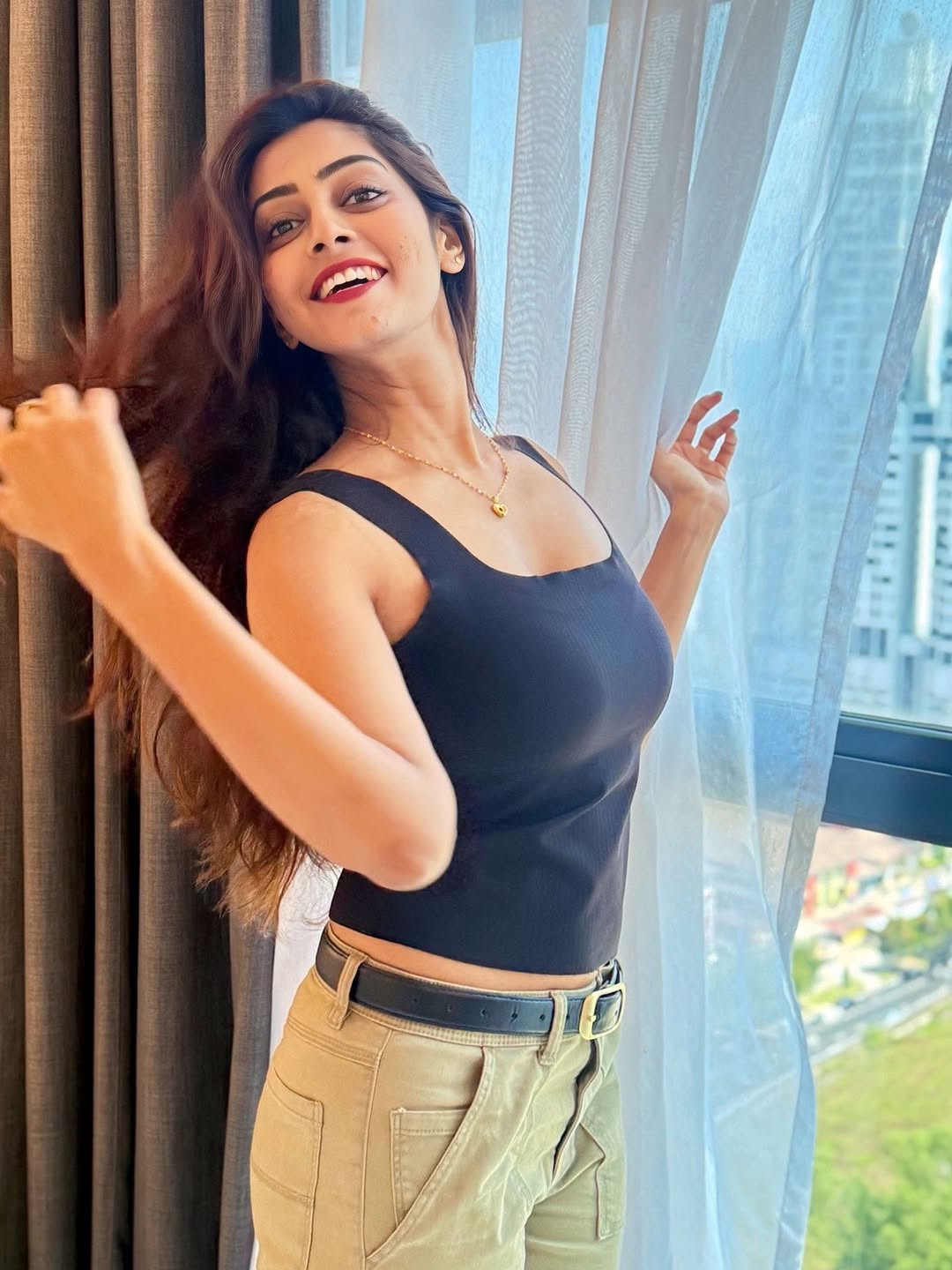 Kuhasini in Black Tank Top By Window With Gold Necklace3