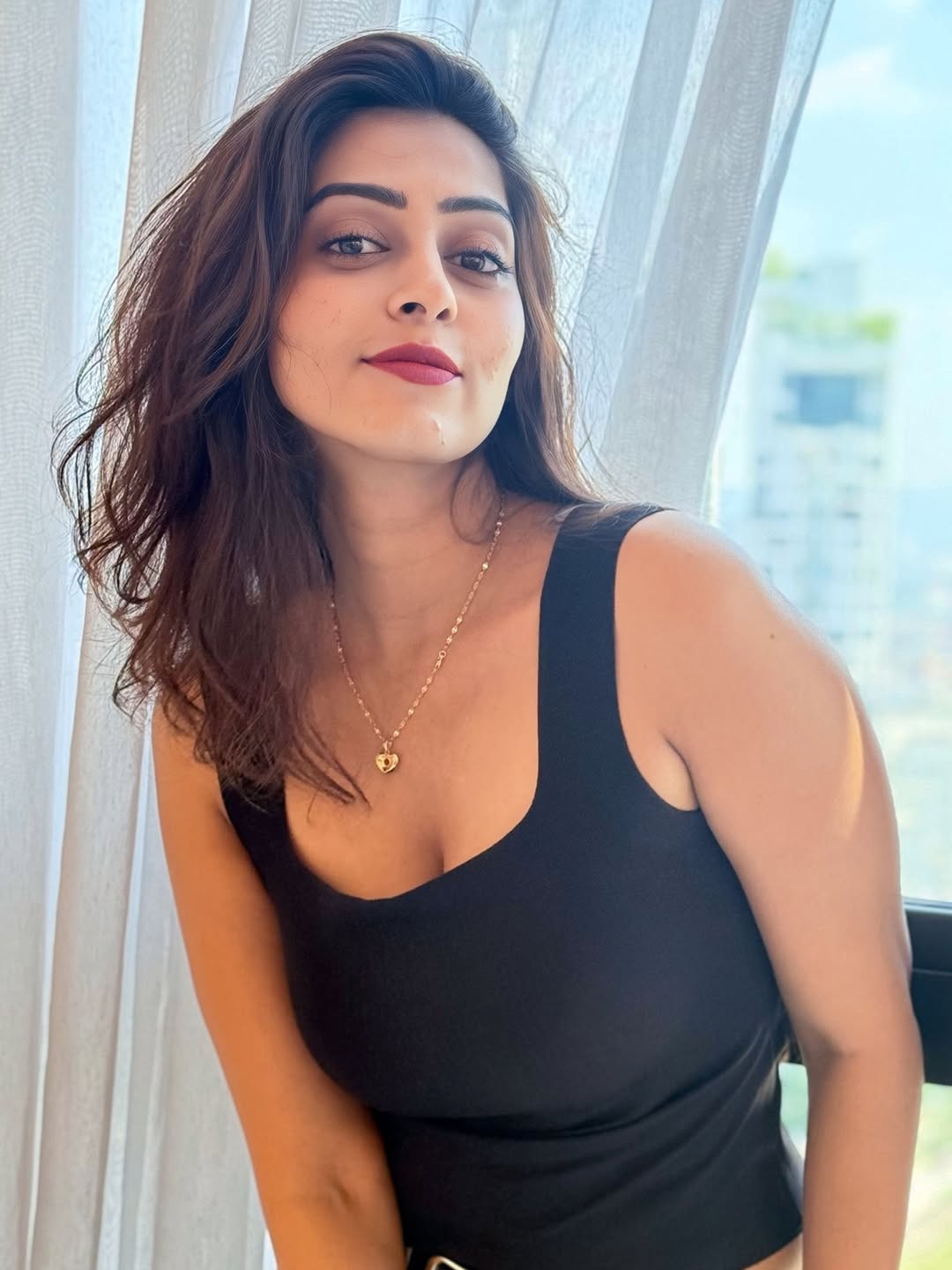 Kuhasini in Black Tank Top By Window With Gold Necklace